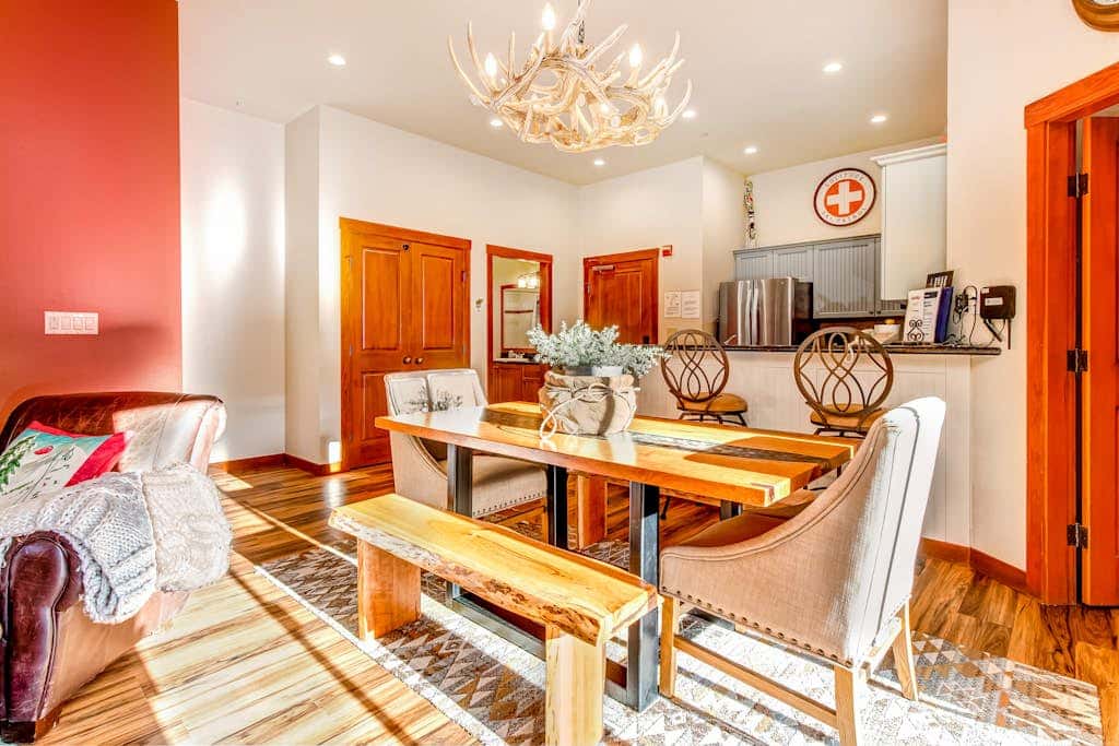 ski-in - ski-out condo with a deck, ski views & a shared pool and hot tub