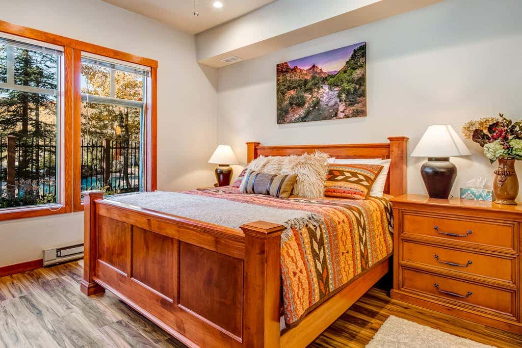ski-in - ski-out condo with a deck, ski views & a shared pool and hot tub