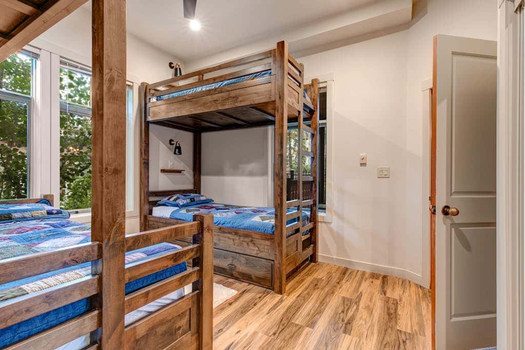 ski-in - ski-out condo with a deck, ski views & a shared pool and hot tub