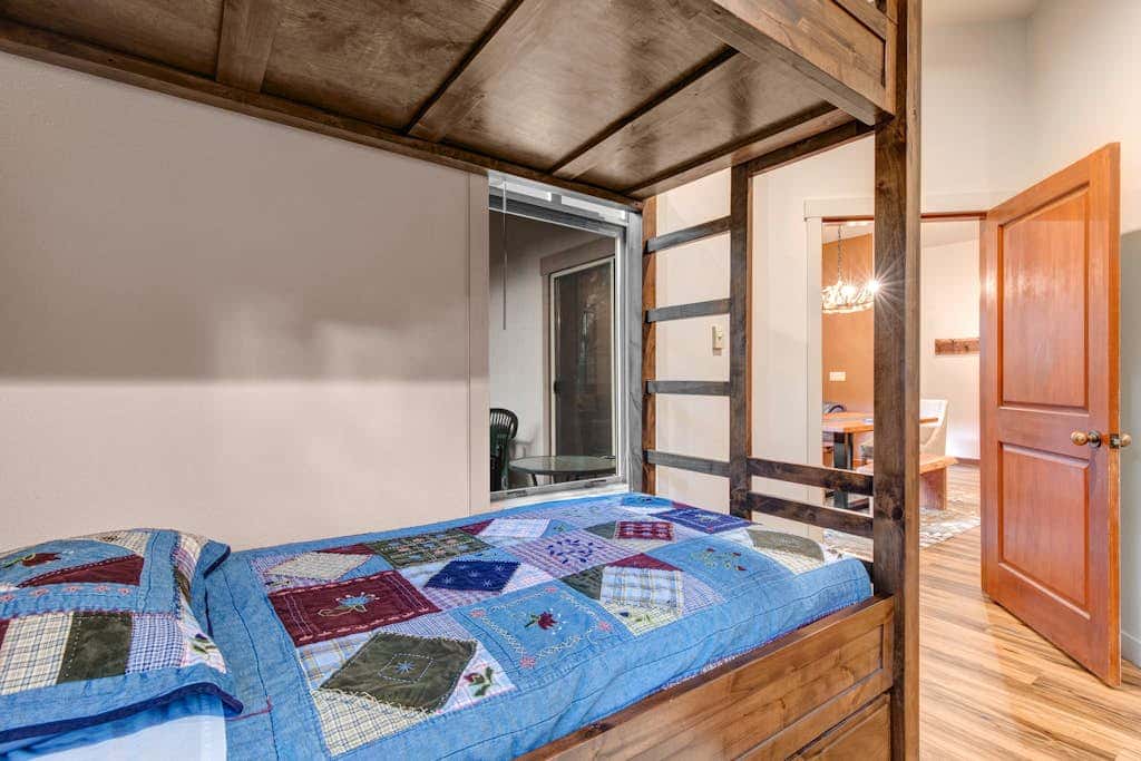 ski-in - ski-out condo with a deck, ski views & a shared pool and hot tub