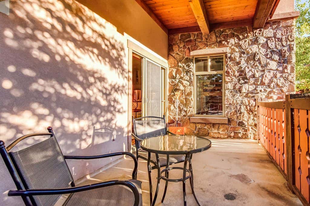 ski-in - ski-out condo with a deck, ski views & a shared pool and hot tub