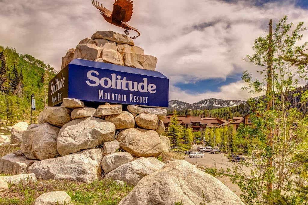 ski-in - ski-out condo with a deck, ski views & a shared pool and hot tub