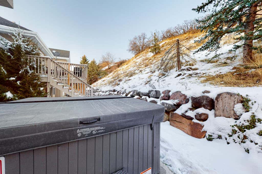 Stylish Ski Retreat with  a Gas Fireplace, Fast WiFi, Private Hot Tub, & Patio