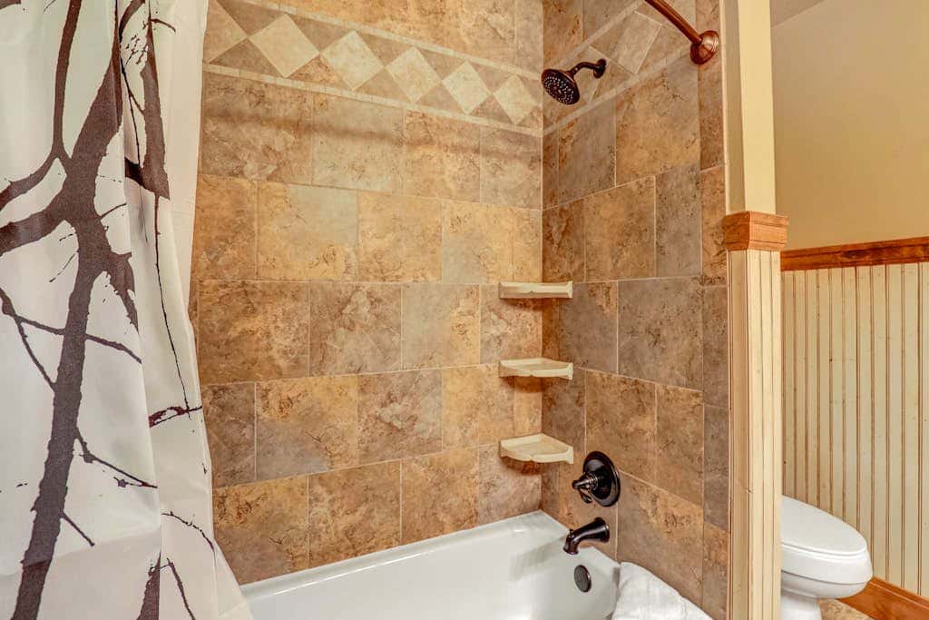 Recently updated townhome with  a private hot tub, deck, & wet bar - bus to slopes