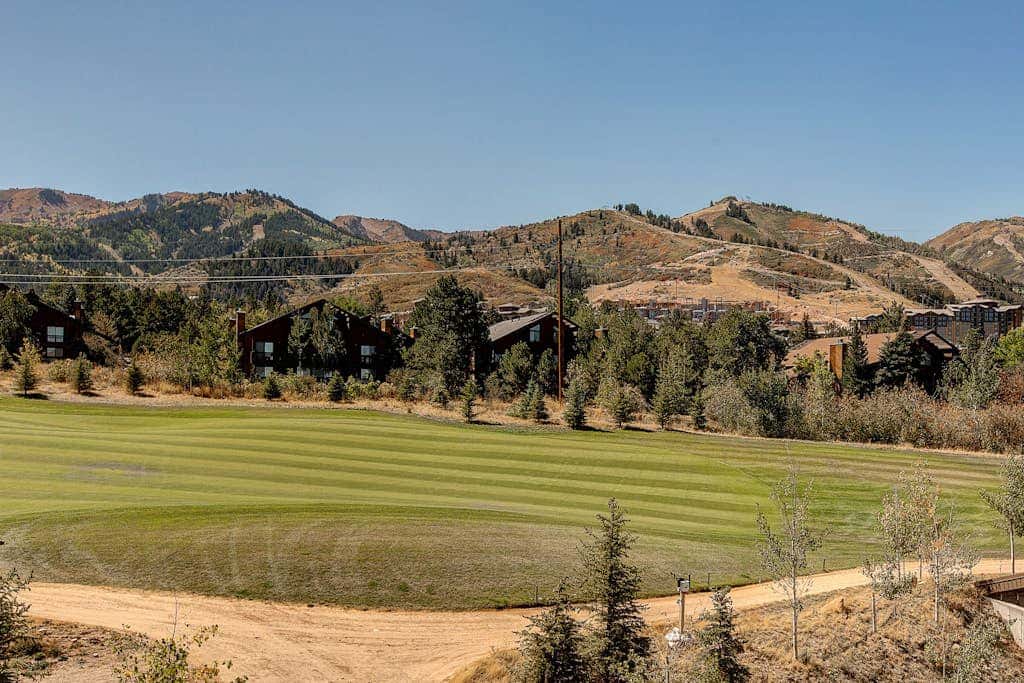 Luxury condo with large deck, pool/hot tub, walk to ski access