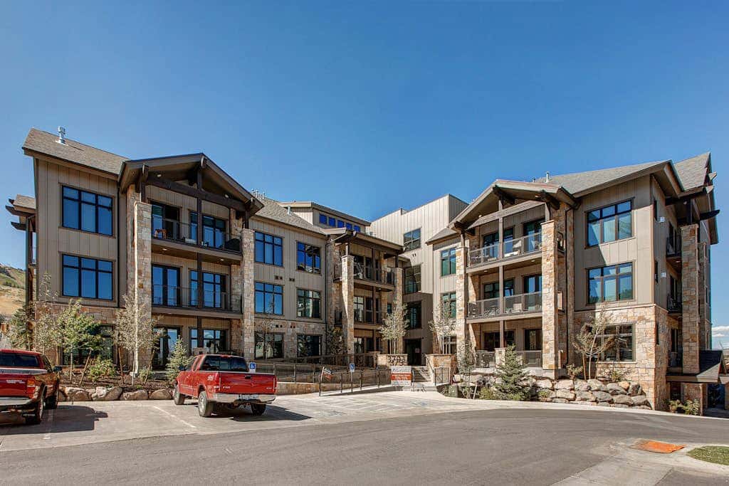 Luxury condo with large deck, pool/hot tub, walk to ski access