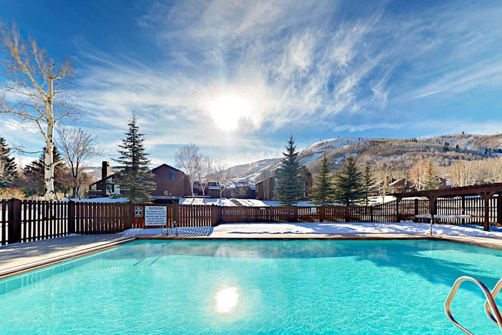 Lavish alpine escape with pool & hot tub - walk to lifts, dining & shops