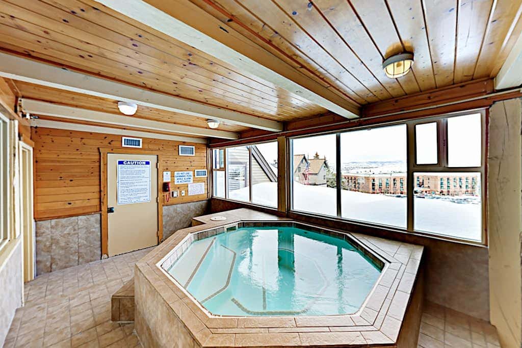 Ski-in - ski-out condo with fireplace, pool, hot tub & sauna - walk to eateries