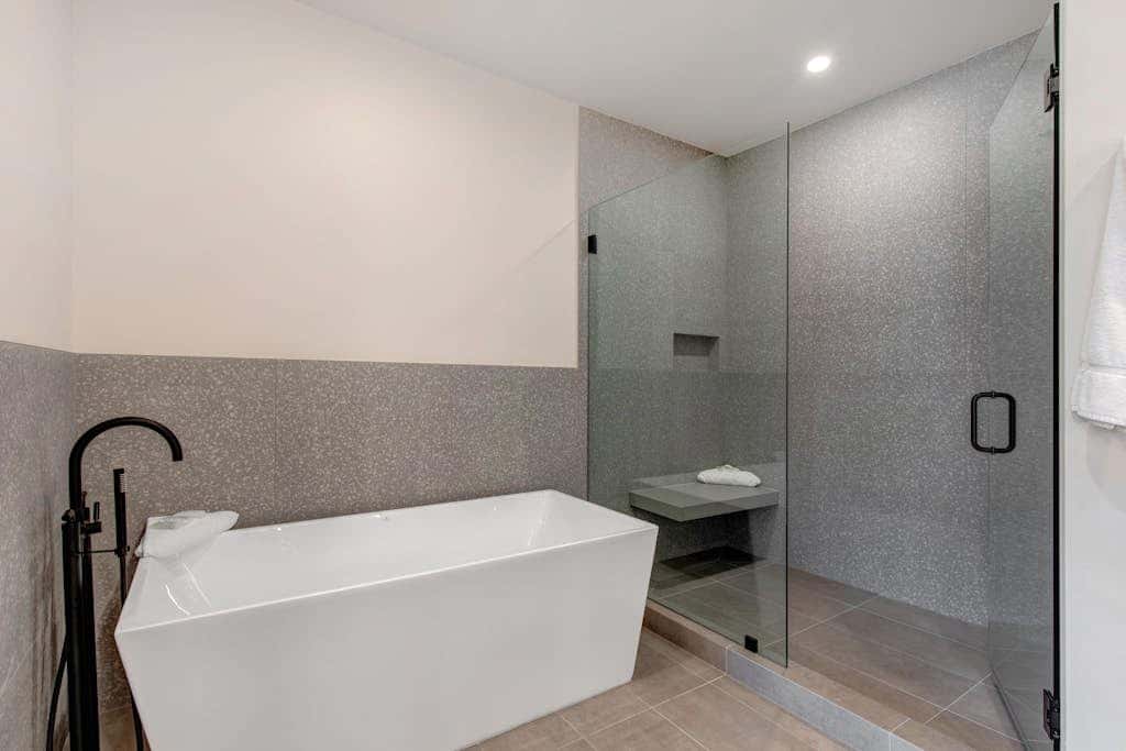 Updated home with a private hot tub, fireplace, & mountain views - dog friendly