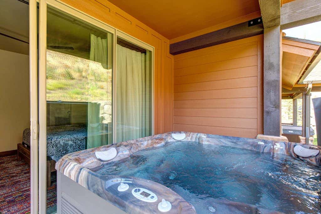 Stunning dog-friendly mountain condo with hot tub, gas grill, & AC