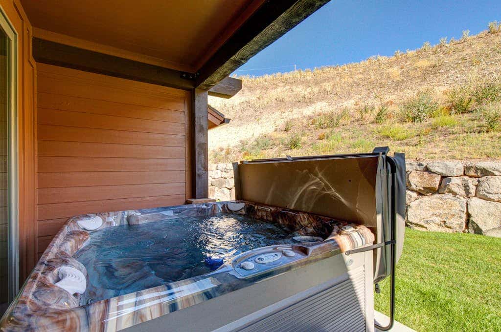 Stunning dog-friendly mountain condo with hot tub, gas grill, & AC