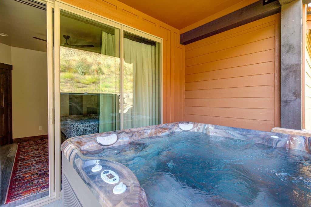 Stunning dog-friendly mountain condo with hot tub, gas grill, & AC