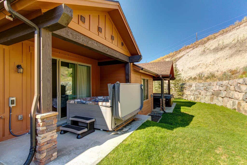 Stunning dog-friendly mountain condo with hot tub, gas grill, & AC