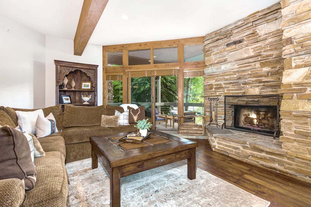 Luxury Deer Valley condo featuring a private hot tub and cozy stone fireplace.