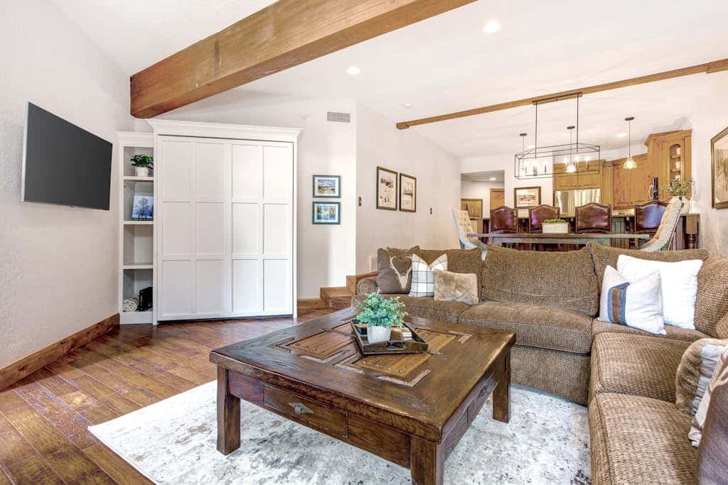 Luxury Deer Valley condo featuring a private hot tub and cozy stone fireplace.