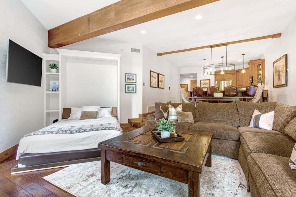 Luxury Deer Valley condo featuring a private hot tub and cozy stone fireplace.
