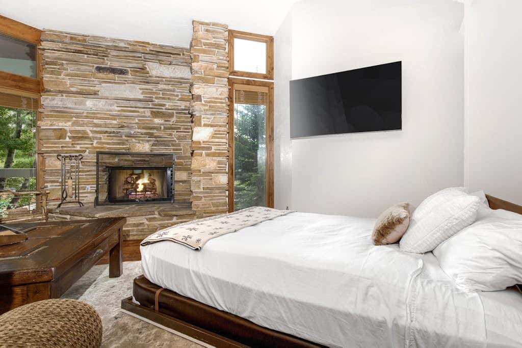 Luxury Deer Valley condo featuring a private hot tub and cozy stone fireplace.