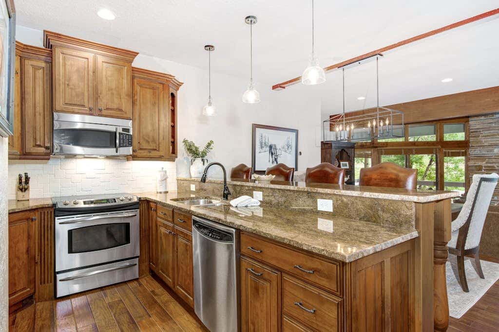 Luxury Deer Valley condo featuring a private hot tub and cozy stone fireplace.