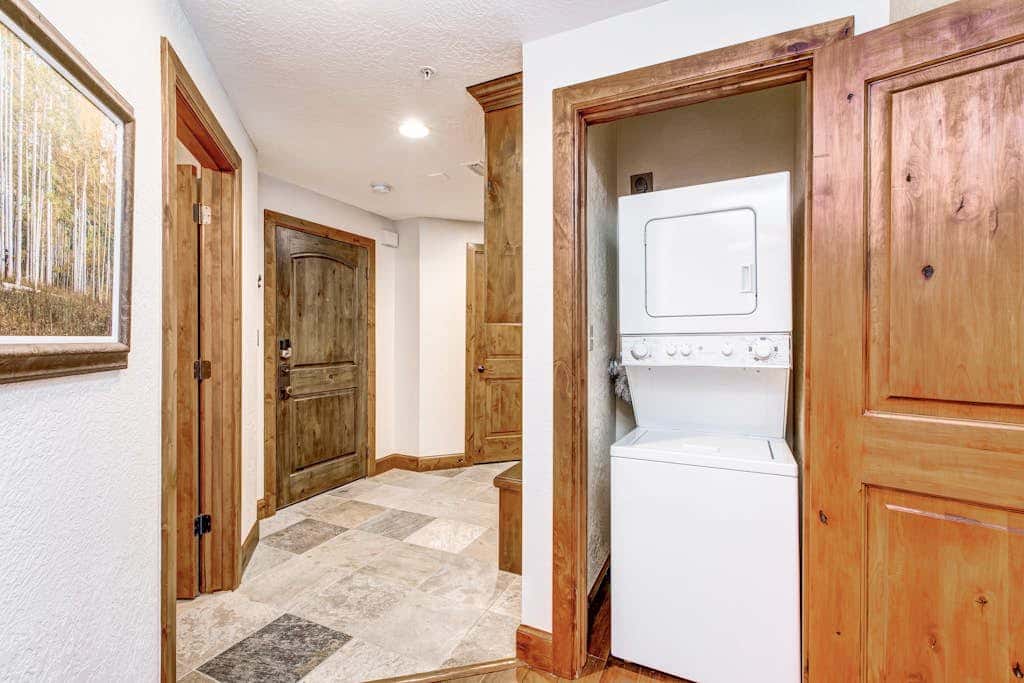 Luxury Deer Valley condo featuring a private hot tub and cozy stone fireplace.