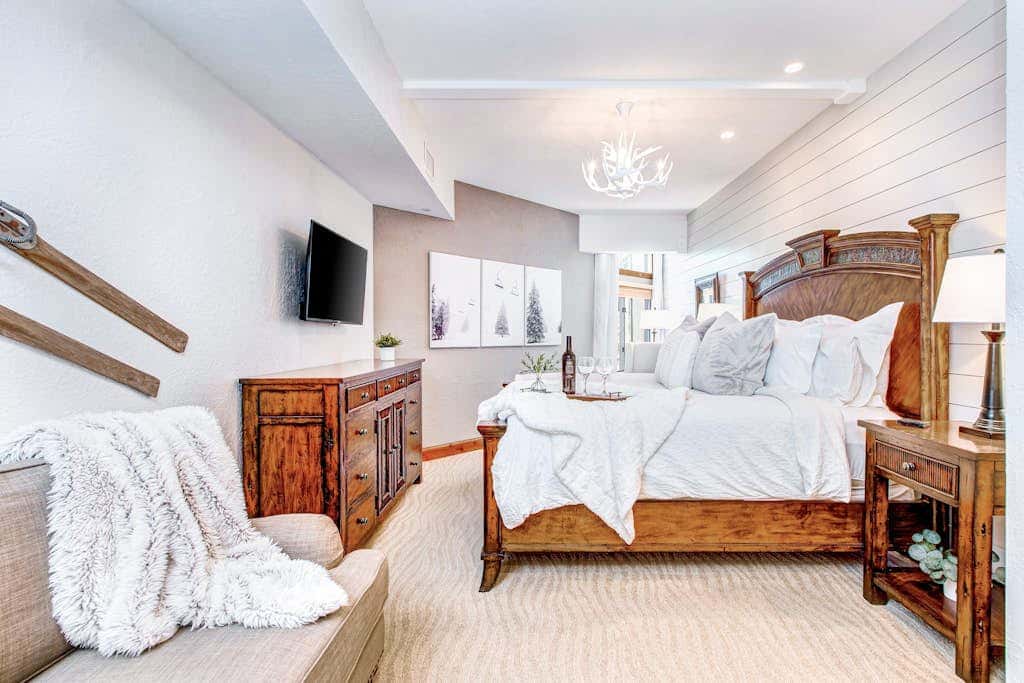 Luxury Deer Valley condo featuring a private hot tub and cozy stone fireplace.