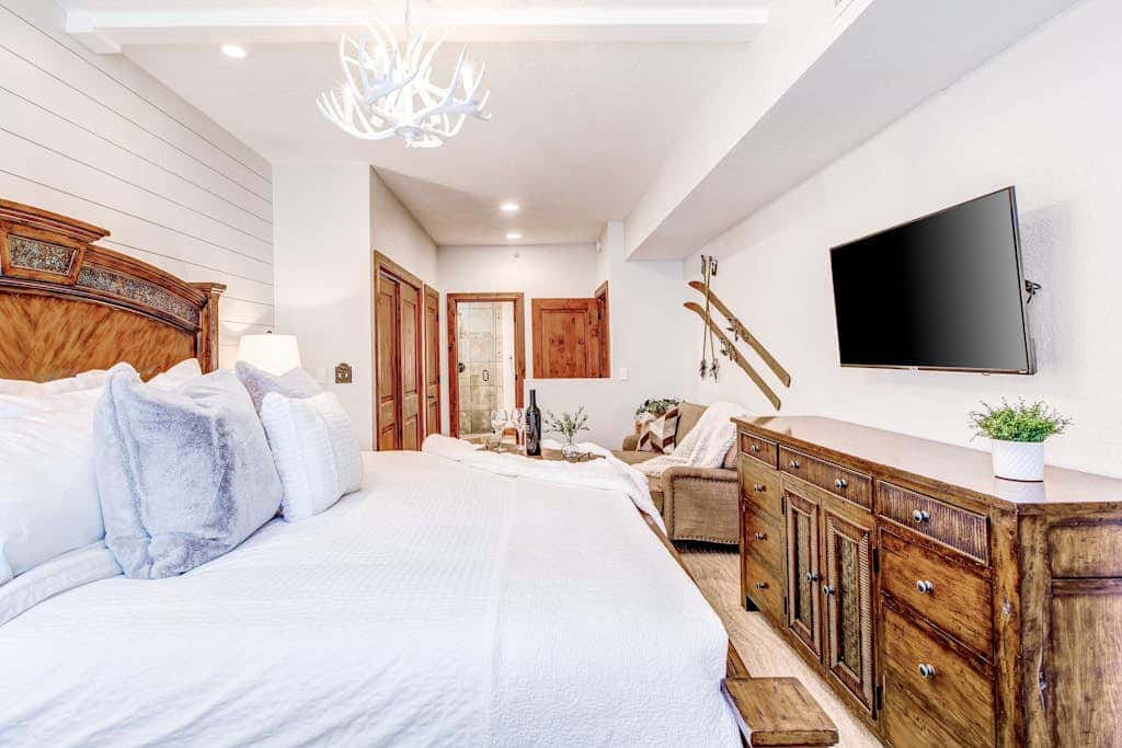Luxury Deer Valley condo featuring a private hot tub and cozy stone fireplace.