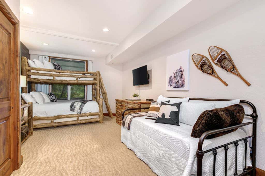 Luxury Deer Valley condo featuring a private hot tub and cozy stone fireplace.