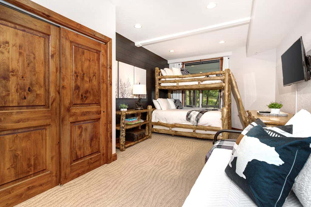 Luxury Deer Valley condo featuring a private hot tub and cozy stone fireplace.