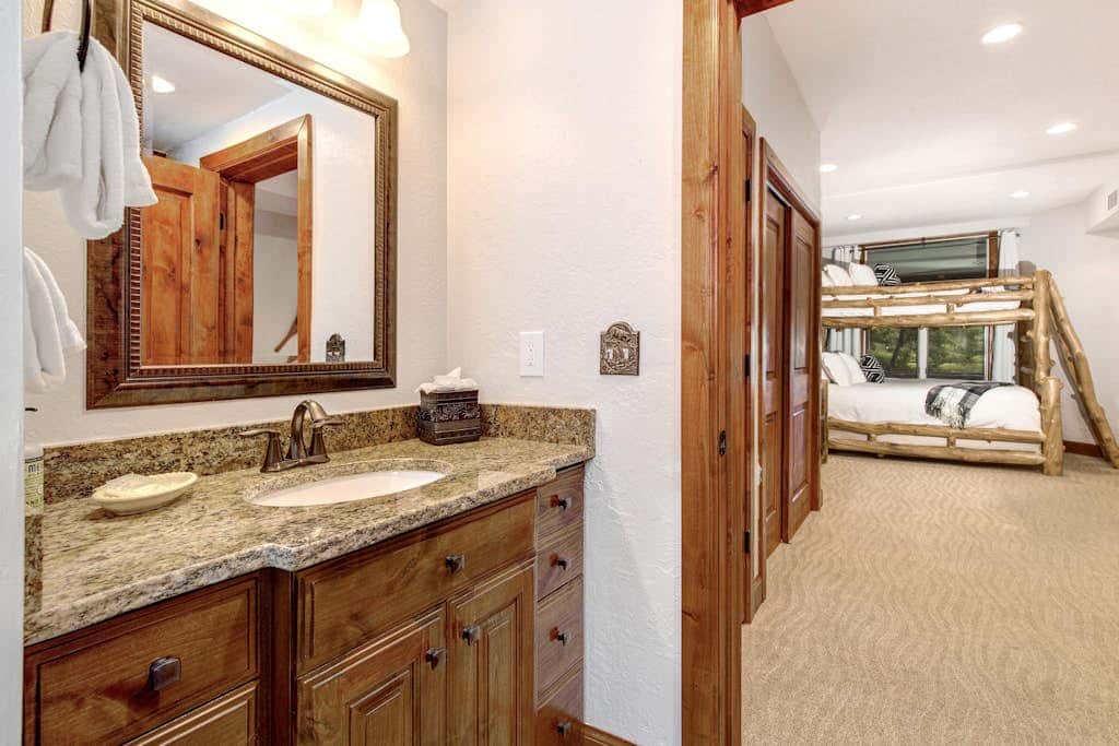 Luxury Deer Valley condo featuring a private hot tub and cozy stone fireplace.