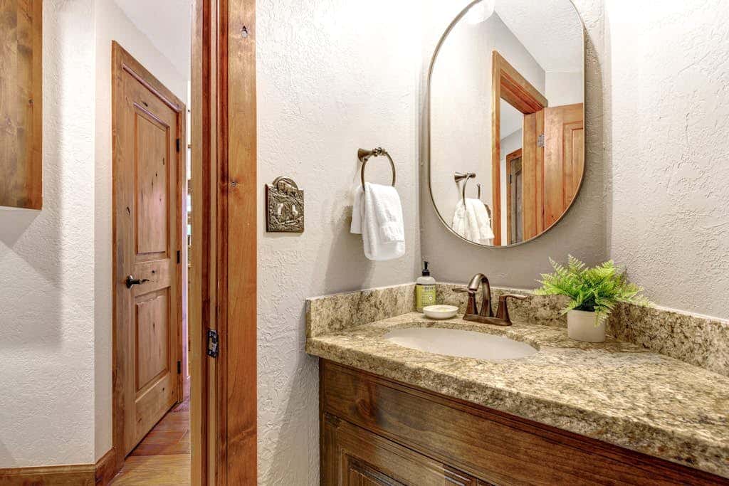 Luxury Deer Valley condo featuring a private hot tub and cozy stone fireplace.