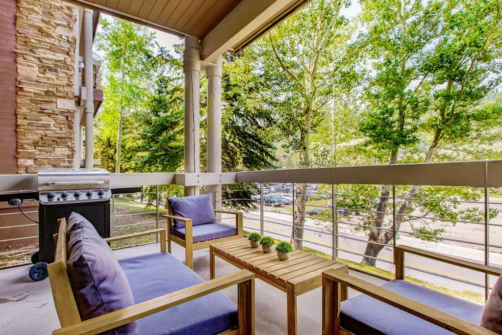 Luxury Deer Valley condo featuring a private hot tub and cozy stone fireplace.
