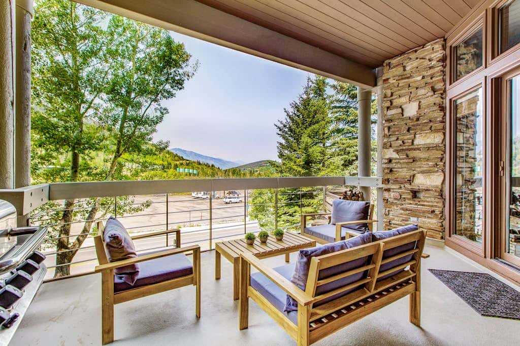 Luxury Deer Valley condo featuring a private hot tub and cozy stone fireplace.