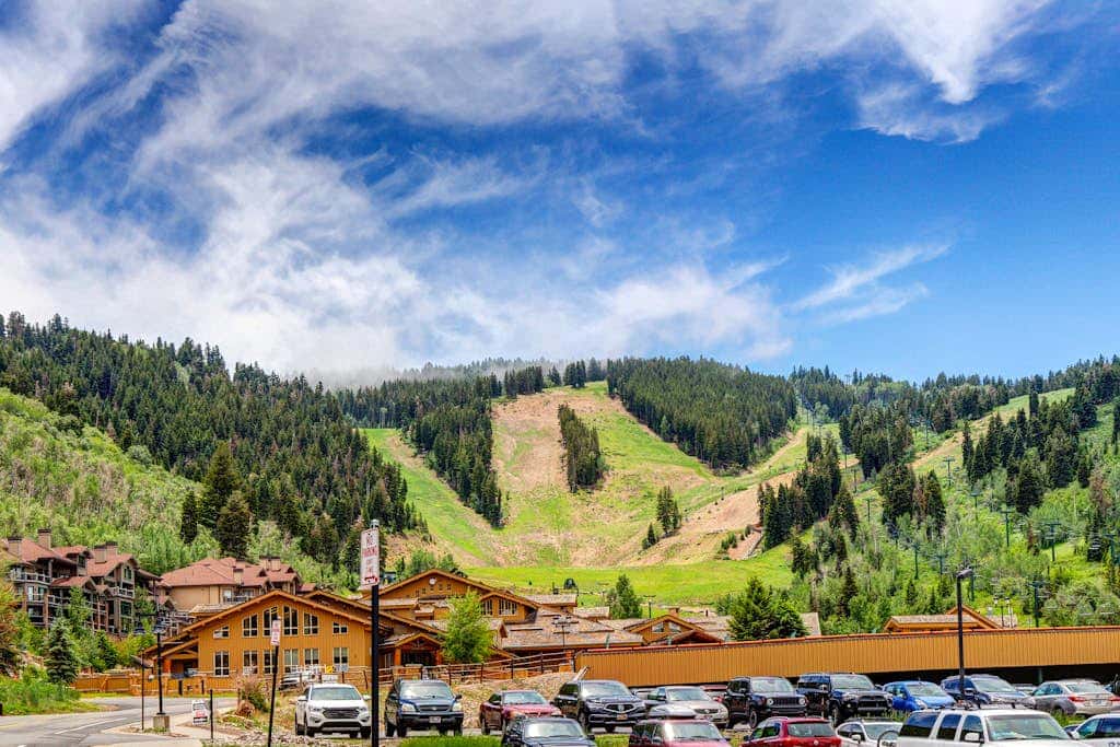 Luxury Deer Valley condo featuring a private hot tub and cozy stone fireplace.