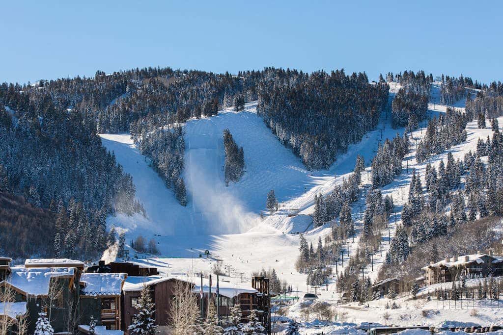 Luxury Deer Valley condo featuring a private hot tub and cozy stone fireplace.