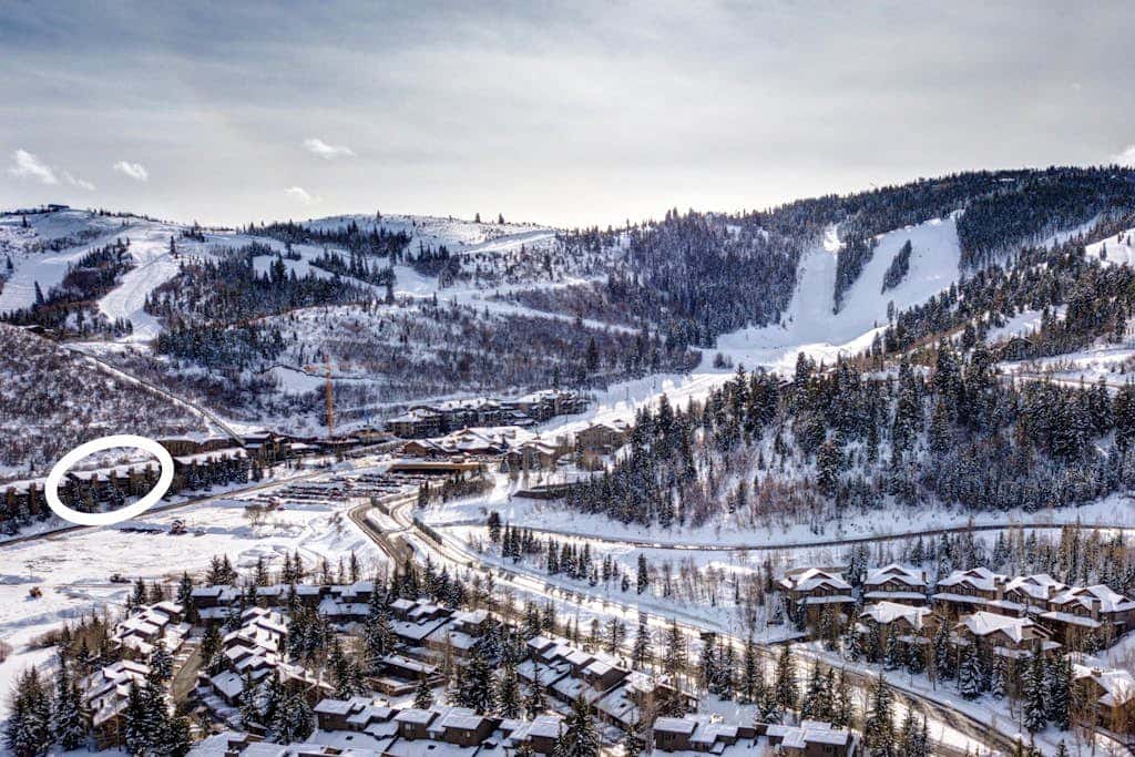 Luxury Deer Valley condo featuring a private hot tub and cozy stone fireplace.