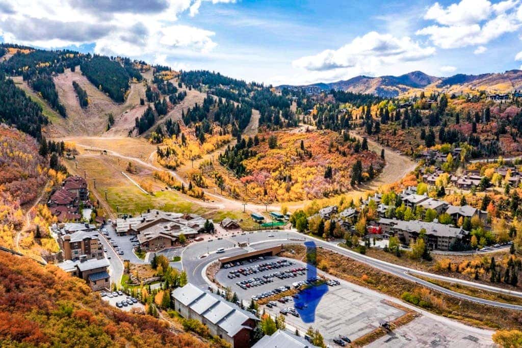 Luxury Deer Valley condo featuring a private hot tub and cozy stone fireplace.