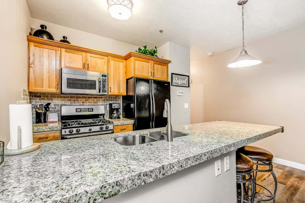 Plush condo with pool, gym, hot tubs, garage & central AC - snowbird-friendly
