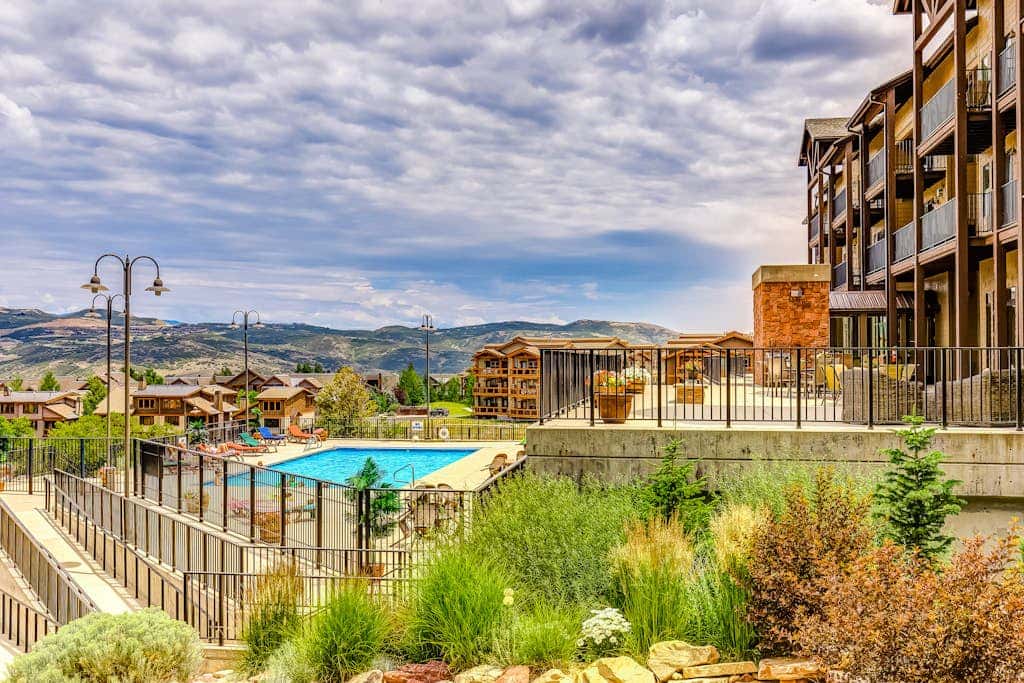 Plush condo with pool, gym, hot tubs, garage & central AC - snowbird-friendly