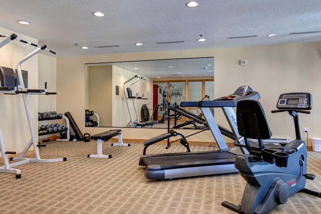 Plush condo with pool, gym, hot tubs, garage & central AC - snowbird-friendly