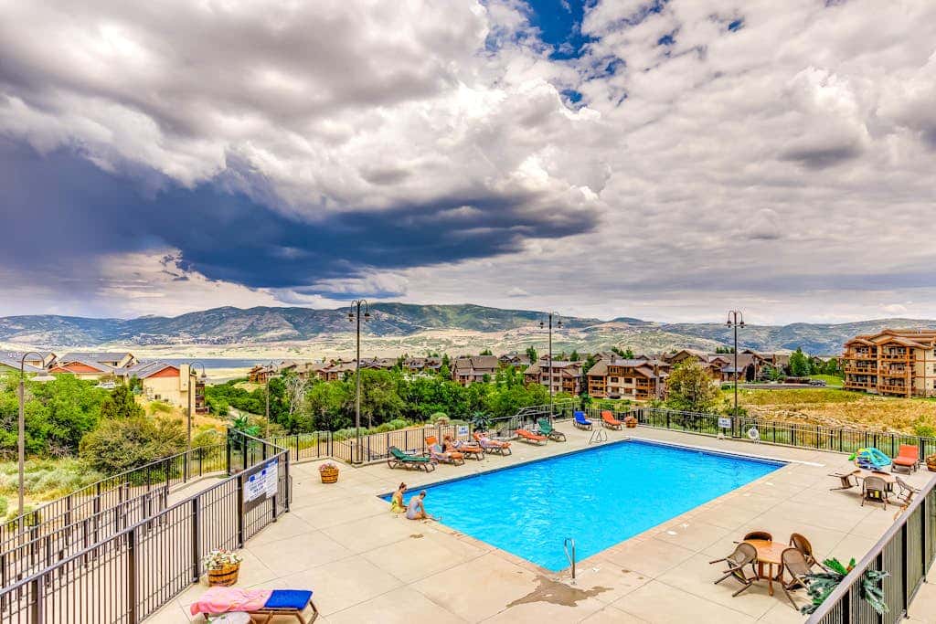 Plush condo with pool, gym, hot tubs, garage & central AC - snowbird-friendly