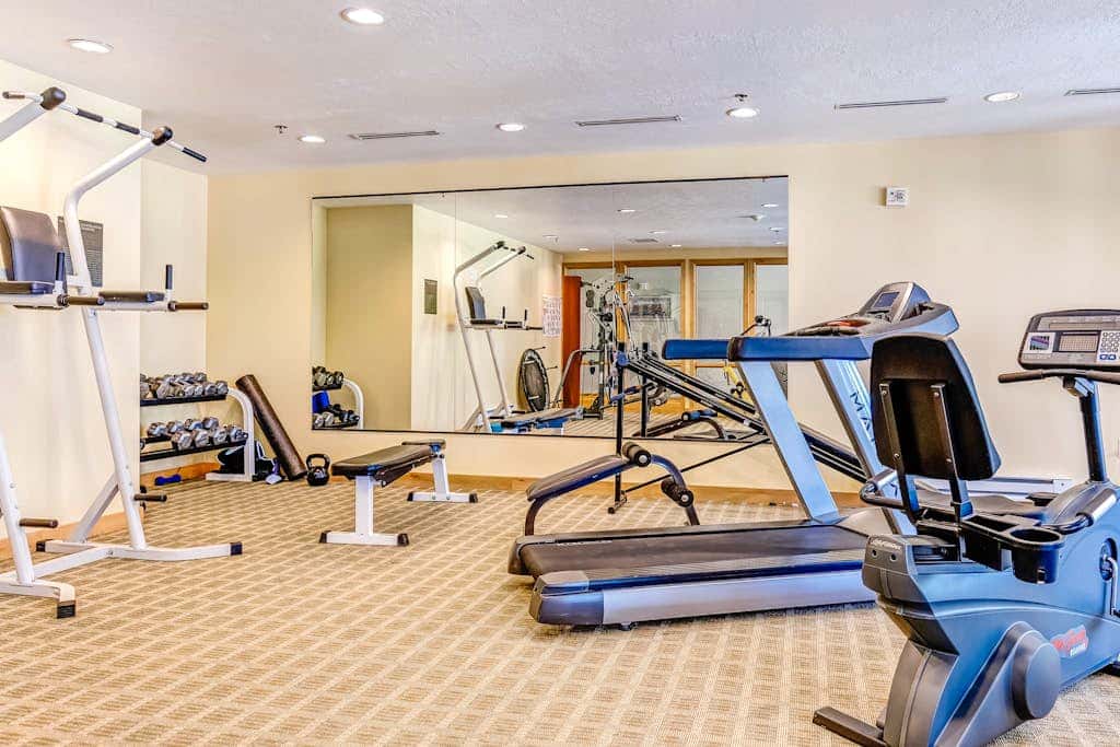 Plush condo with pool, gym, hot tubs, garage & central AC - snowbird-friendly