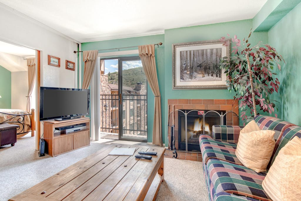 Top-floor, mountain view condo with fireplace, pool & hot tub - steps to shuttle
