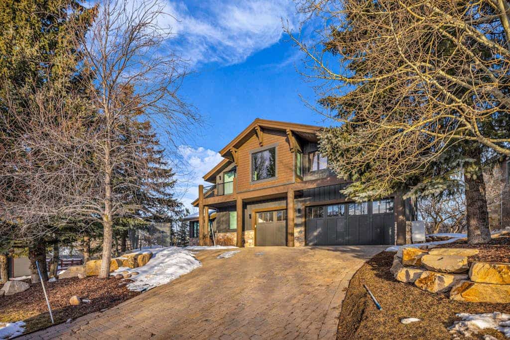 Mountain-view abode with a hot tub, scenic balcony, fireplaces, & free shuttle