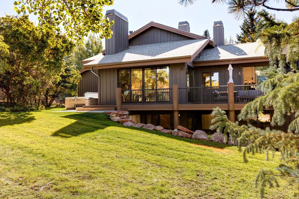 Mountain-view abode with a hot tub, scenic balcony, fireplaces, & free shuttle