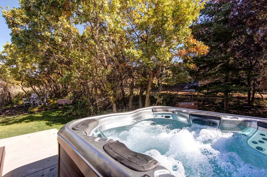 Mountain-view abode with a hot tub, scenic balcony, fireplaces, & free shuttle
