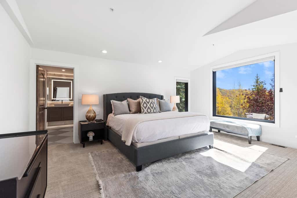 Mountain-view abode with a hot tub, scenic balcony, fireplaces, & free shuttle