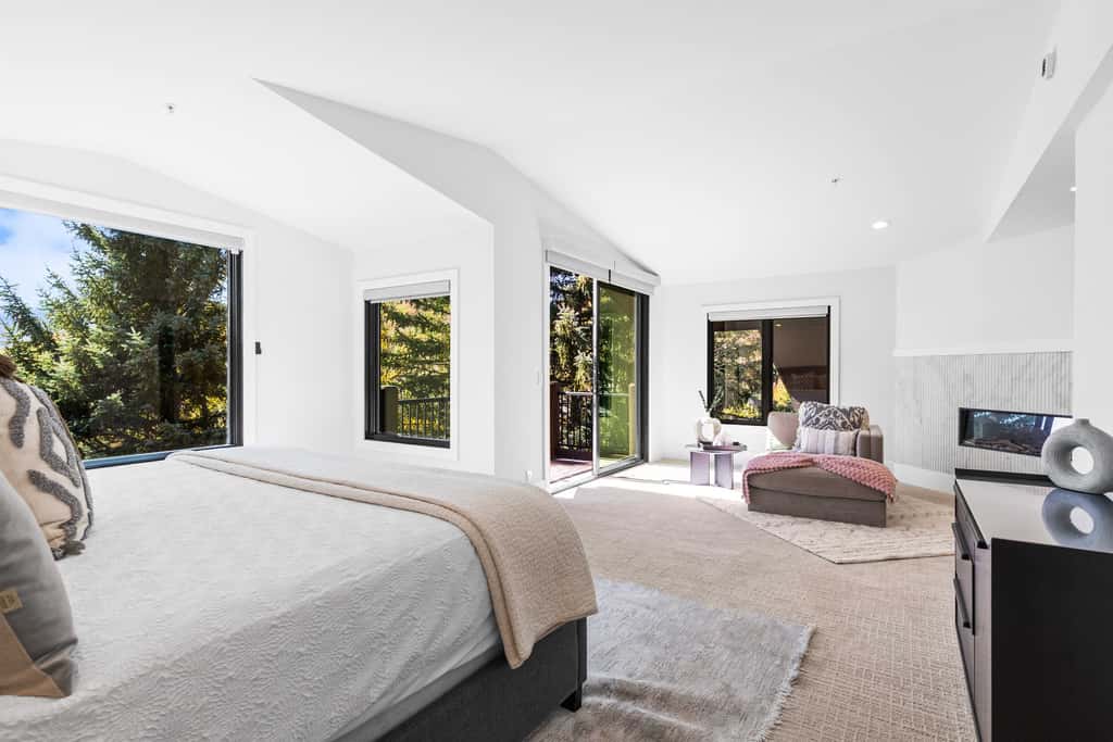 Mountain-view abode with a hot tub, scenic balcony, fireplaces, & free shuttle