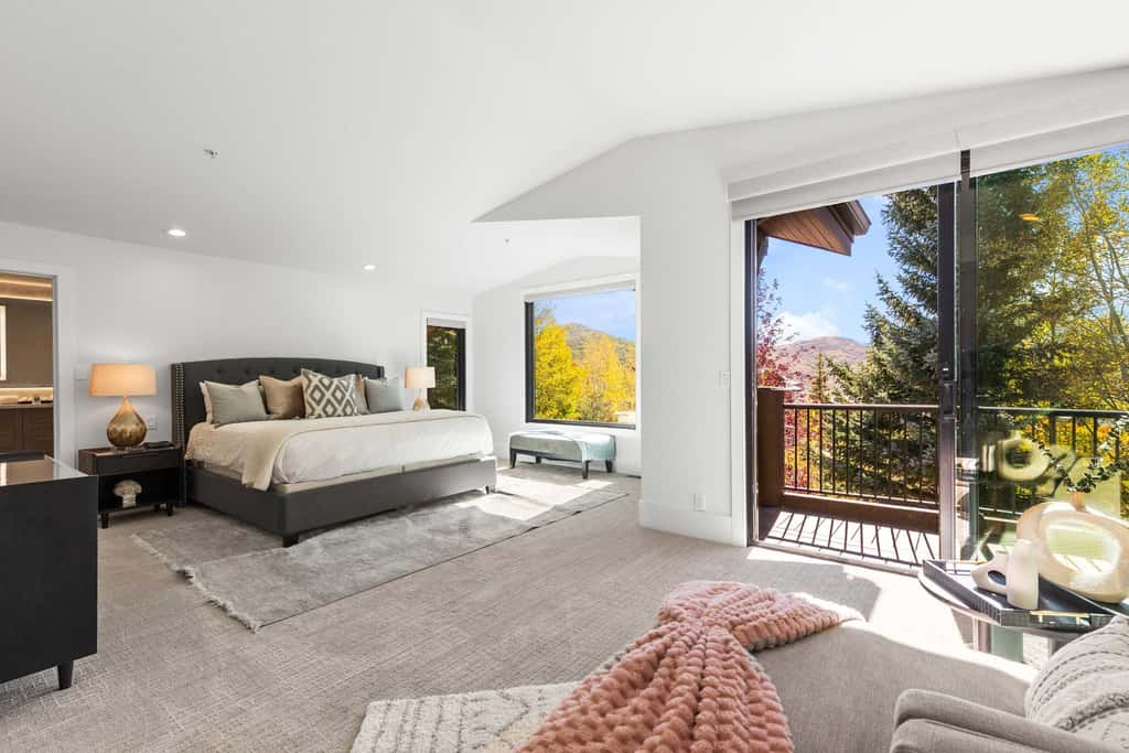Mountain-view abode with a hot tub, scenic balcony, fireplaces, & free shuttle