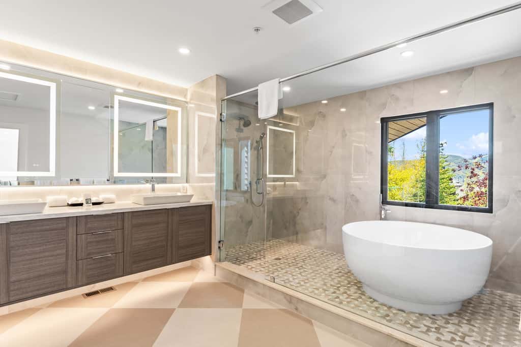 Mountain-view abode with a hot tub, scenic balcony, fireplaces, & free shuttle