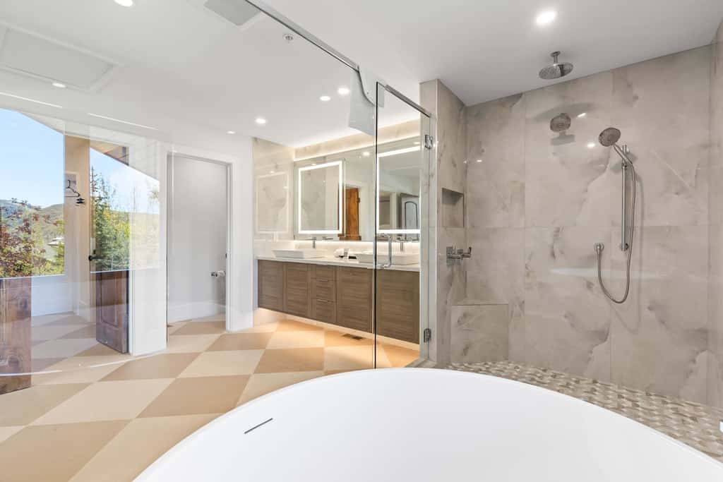 Mountain-view abode with a hot tub, scenic balcony, fireplaces, & free shuttle