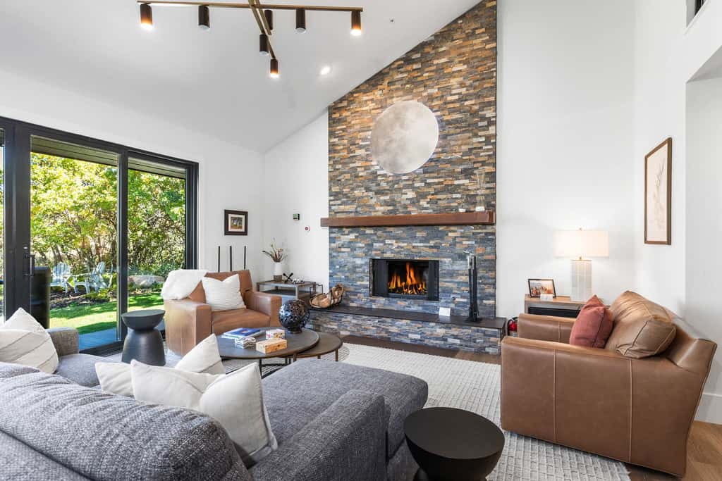 Mountain-view abode with a hot tub, scenic balcony, fireplaces, & free shuttle